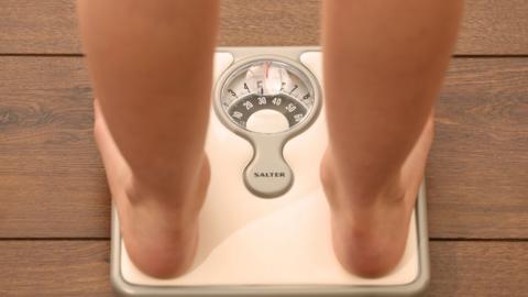 Young person on scales