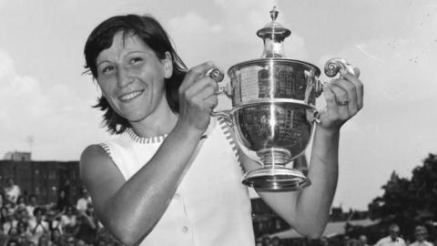Olga Morozova holds the Queen's trophy