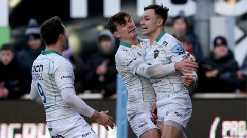 Tom Collins celebrates his try