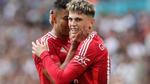 Manchester United players celebrate a goal