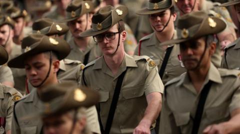 Members of the ADF marching