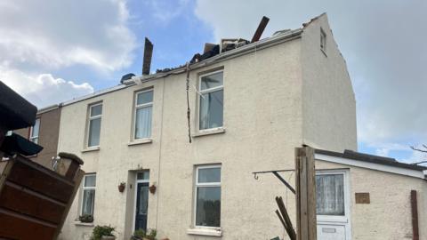 A home with its roof blown off in Rue de Flicquet, St Martin