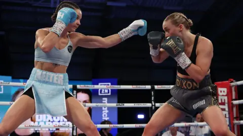 Terri Harper and Rhiannon Dixon in the ring
