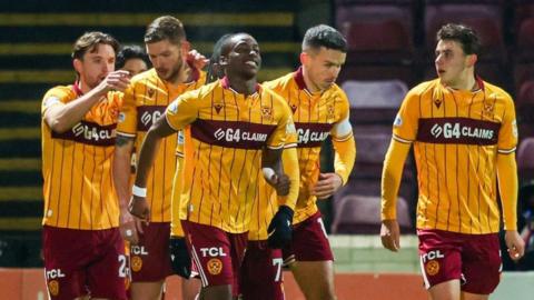 Motherwell celebrate their opening goal in a one-sided game at Fir Park