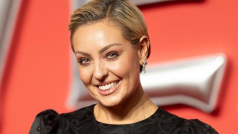 Amy Dowden attending the UK Premiere of "Venom: The Last Dance" at the BFI IMAX Waterloo in October 2023. 