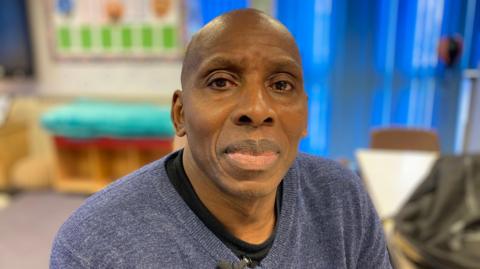 This is a picture of Lud Ramsey. He is the Chair of the African Caribbean Community Association which supports people and teaches about black history and culture in the north east Derbyshire area. 