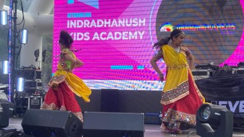 Dancers on stage at a festival