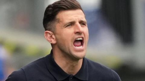 John Mousinho shouting