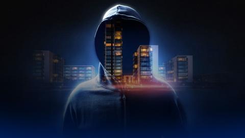 S hooded figure