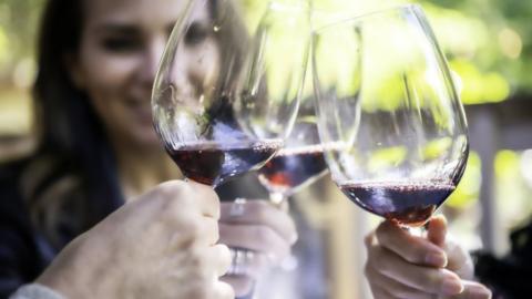 Woman drinking with friends