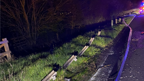 Damaged crash barrier