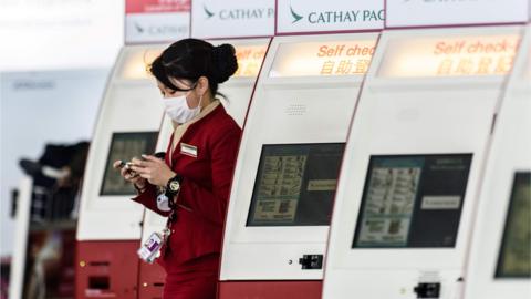 Cathay Pacific cabin crew with mask