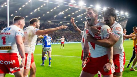 St Helens players celebrate their late win over Leeds