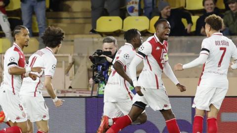 Monaco players celebrate scoring against Aston Villa