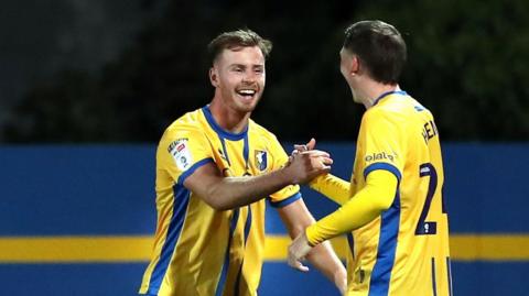 Mansfield Jamie McDonnell celebrates scoring against Blackpool