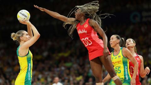 England's Funmi Fadoj challenging Australia's Kiera Austin.