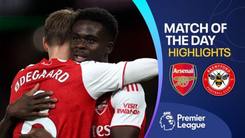 Martin Odegaard and Bukayo Saka embrace