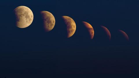 The image is blacked out except for the phases of the Moon, from left to right it is getting more and more out of vision, covered by shadow and deepening in colour starting from a cream shade and ending as a burnt orange colour.