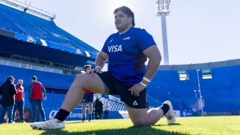 Francisco Moreno stretches before an Argentina training session