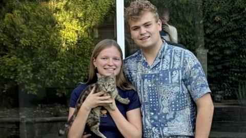 Grace and Ollie with their pet cat