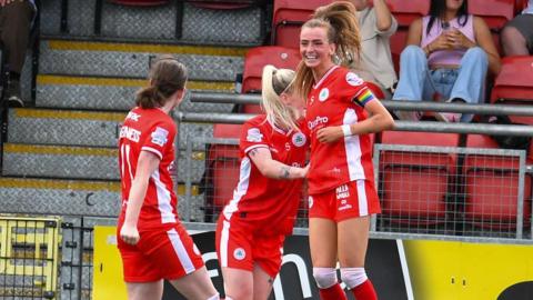 Caitlin McGuinness celebrates scoring