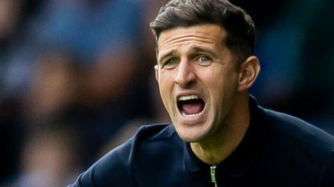 John Mousinho shouting
