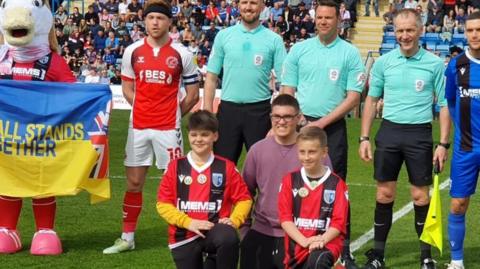 Daniel and Gillingham players at Priestfield