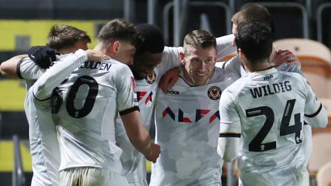 Newport County players group up to celebrate Omar Bogle's goal