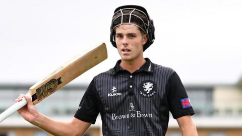 Archie Vaughan celebrates scoring century