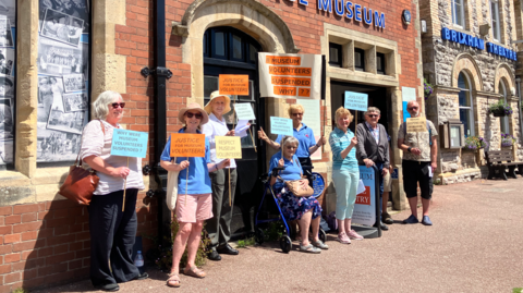 Protesters outside a museum in Brixham