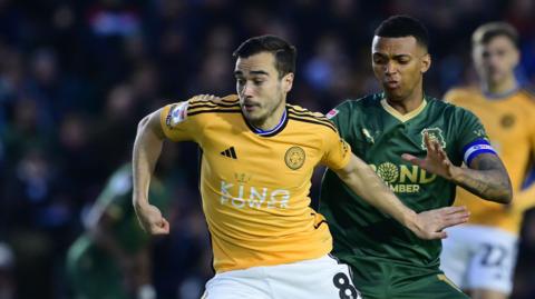 Harry Winks and Morgan Whittaker in action