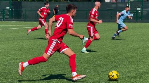 Action from Jersey Bulls v Hastings United