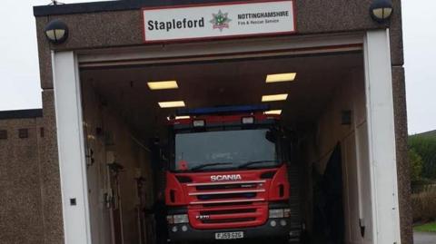 A fire engine inside the bay of Stapleford Fire Station