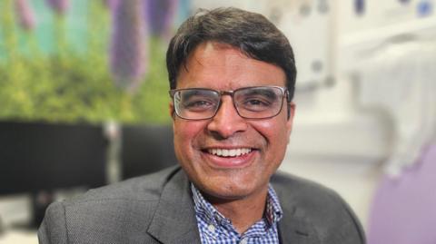 Consultant Dr Kailash Krishnan, sat in his office