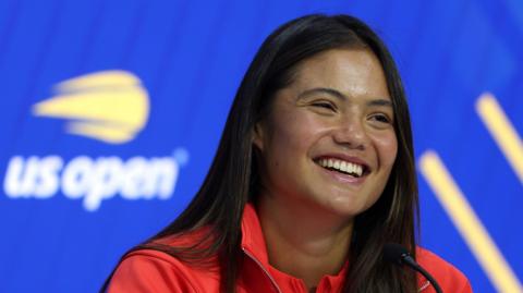 Emma Raducanu smiles during her US Open news conference