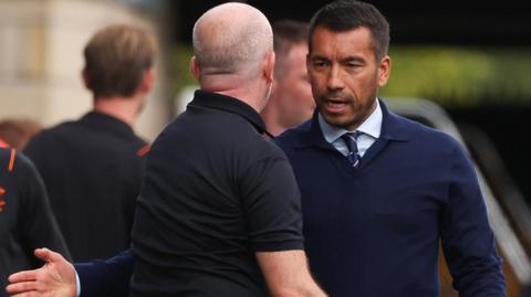 Livingston's David Martindale and Rangers' Giovanni van Bronckhorst