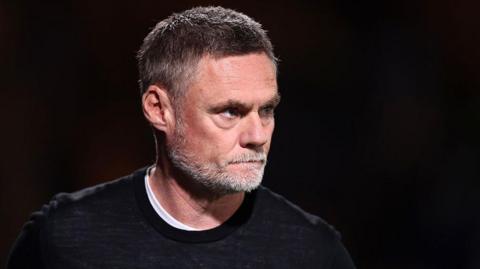 Bradford manager Graham Alexander looking concerned