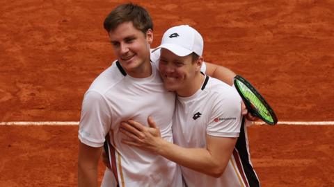 Harri Heliovaara of Finland and Henry Patten of Great Britain celebrate winning match point against Quentin Halys and Pierre-Hugues Herbert of France