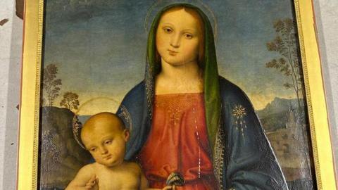 A Renaissance painting of a woman sitting down with a baby on her knee, who is also facing forwards 