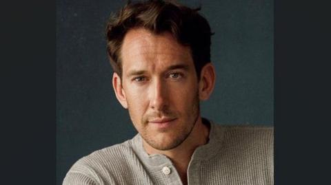 Ollie Savile, from Buxton, said this nomination 'means everything' to him. He is pictured in a grey top and is looking at the camera.