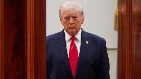 US President Donald Trump arrives for a prime-time address to the nation in the Cross Hall of the White House in Washington, DC, US, on Wednesday, 1 April, 2026.