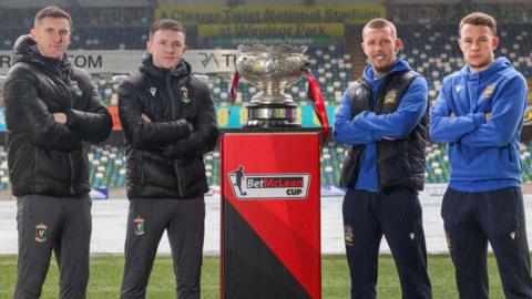 Marcus Kane and James Singleton of Glentoran, with Kirk Millar and Kyle McClean of Linfield