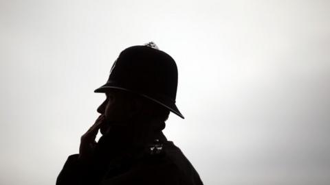 Silhouette of policeman
