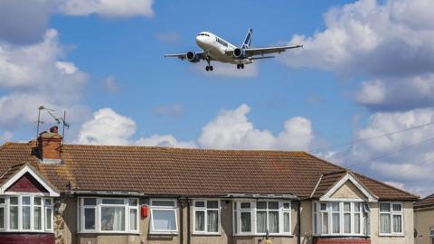 Plane flying over homes near Heathrow airport