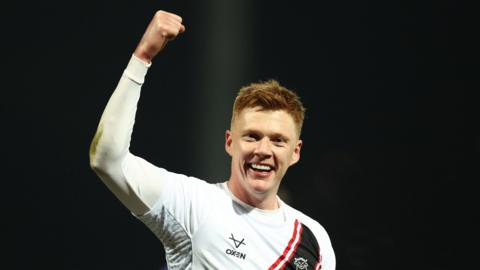 Lincoln's Sam Clucas celebrates his goal at Mansfield