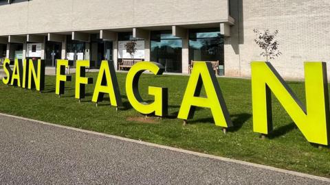 St Fagans Natural History Museum with a large Sain Ffagan sign stood out the front in capital letters - Sain Ffagan is Welsh for St Fagan