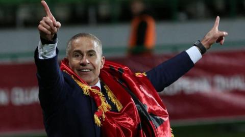 Albania manager Sylvinho celebrates