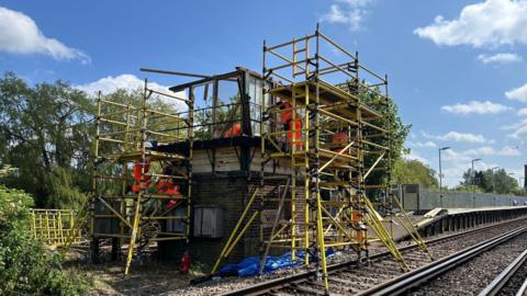 The signal box at Wye being dismantled by Network Rail engineers.