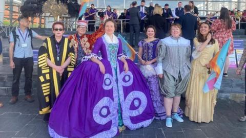 Colourful performers on the steps of the Senedd