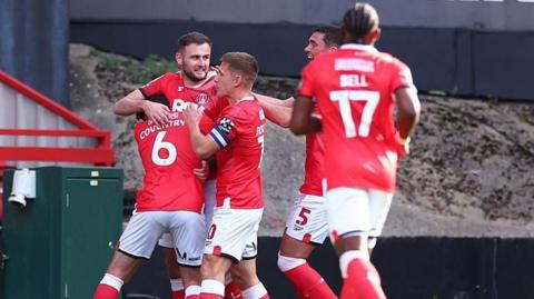 Charlton players celebrate scoring against Blackburn